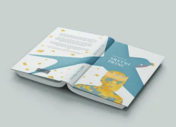 Mockup of the book Sretni princ lying open, showing a blue swallow across the cover