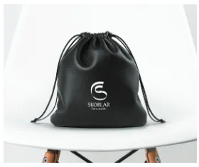 Black drawstring pouch with the monogram in white